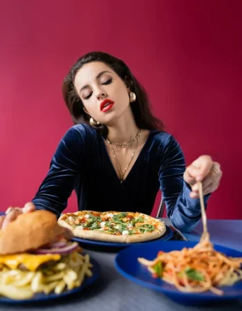 stock-photo-sexy-elegant-woman-taking-spaghetti-plates-pizza-burger-blue-table stock-photo-sexy-elegant-woman-taking-spaghetti-plates-pizza-burger-blue-table